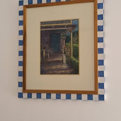 Framed Watercolor Porch Scene with Hand-Painted Checkered Frame
