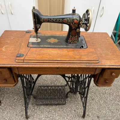 Sale Photo Thumbnail #297: Antique Singer Treadle Sewing Machine in Oak Cabinet with Cast Iron Base & Accessories