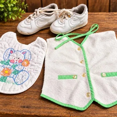 Sale Photo Thumbnail #377: Quilted Baby Bib, Terry Vest & 1980s Nike Toddler Shoes