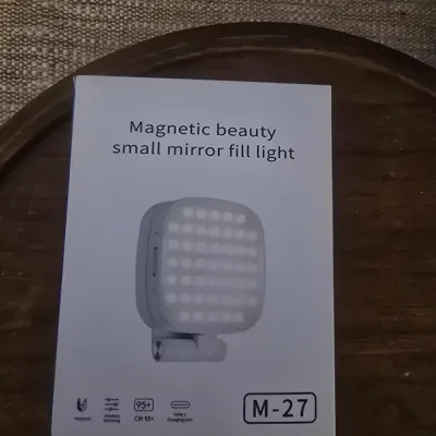Sale Photo Thumbnail #192: A magnetic beauty small mirror fill light, model M-27. Features stepless dimming, CRI 95+, and a Type-C charging port. Appears to be new in its original packaging.