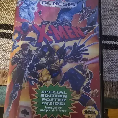 Sale Photo Thumbnail #189: Vintage X-Men video game for the Sega Genesis 16-bit console. Comes in its original plastic clamshell case with cover art. The cover indicates a 'Special Edition Poster Inside!' That is missing