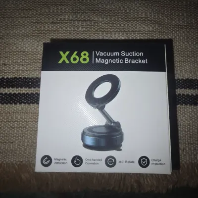 Sale Photo Thumbnail #196: New in box X68 Vacuum Suction Magnetic Bracket. Features magnetic attraction, one-handed operation, 360-degree rotation, and charge protection. Ideal for hands-free phone mounting.
