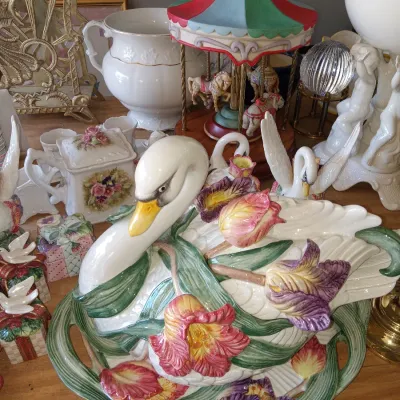 Fitz and Floyd ceramic swan tureen with matching platter, decorated with colorful tulips and green leaves, surrounded by various vintage...