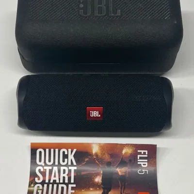 
JBL Flip 5 Bluetooth Speaker With Case, Manual, And Charger