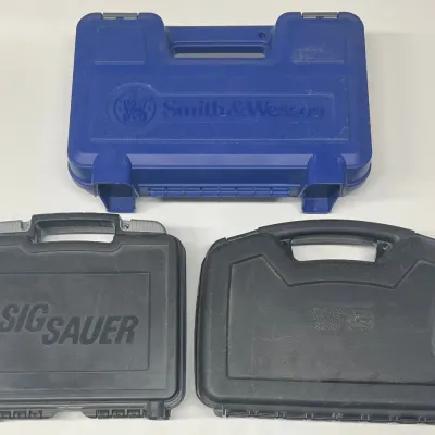 (3) Plastic Handgun Cases - Smith & Wesson, Sig Saur, & Rock Island Armory