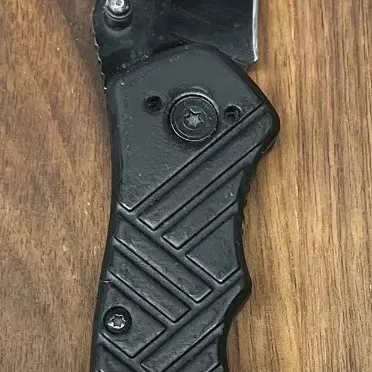 
Unmarked Black Metal Folding Pocket Knife