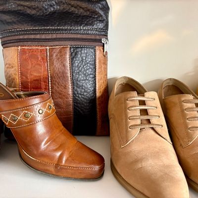 Sale Photo Thumbnail #75: Rialto brown leather heeled mules with studded details, paired with tan suede lace-up shoes and a patchwork leather crossbody bag.