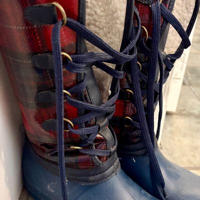 Sale Photo Thumbnail #87: Pair of lace-up winter boots featuring blue rubber lowers, red and black plaid shafts, and a cozy faux-shearling lining.