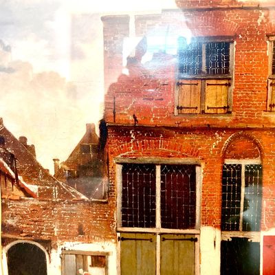 Sale Photo Thumbnail #81: Framed print of Johannes Vermeer's "The Little Street," depicting a detailed brick house facade in Delft with figures engaged in daily tasks.