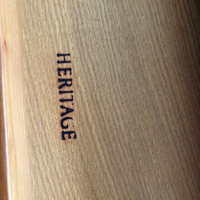 Sale Photo Thumbnail #95: Heritage maker's mark branded into the light-colored wood interior of a furniture drawer.