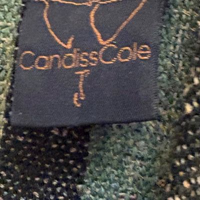 Candiss Cole designer label on a hand-woven textile garment.