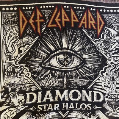 Def Leppard "Diamond Star Halos" woven tapestry blanket, featuring the album's signature eye graphic and mystical artwork.
