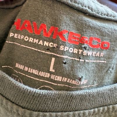 Hawke & Co. Performance Sportswear green t-shirt, size large, showing some wear and small holes near the printed collar label.