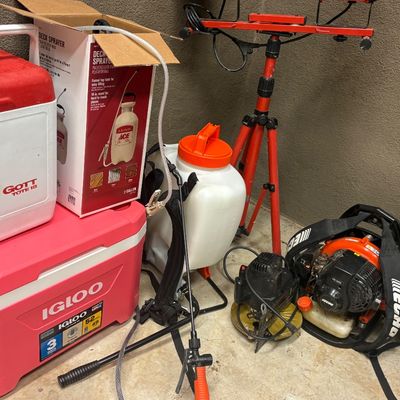 Assorted outdoor and utility gear, including an Igloo cooler, a Gott Tote 18 cooler, a backpack sprayer, an Echo leaf blower, and a...