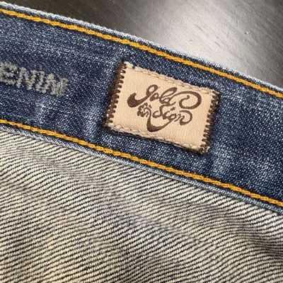 Goldsign denim jeans featuring a stitched brand label on the inner waistband.
