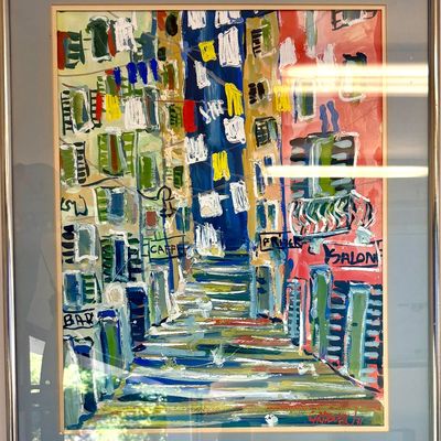 Framed abstract expressionist painting depicting a colorful European street scene with storefronts and laundry lines, signed and dated...