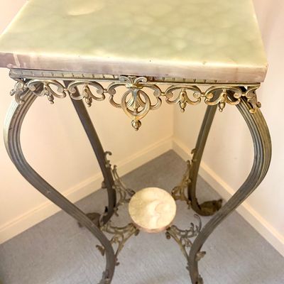 Vintage brass and green onyx pedestal table featuring ornate scrollwork, cabriole legs, and a small lower onyx tier.