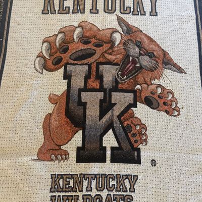 University of Kentucky Wildcats woven tapestry throw blanket, featuring the wildcat mascot and UK logo.