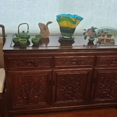Carved rosewood buffet cabinet.  Chairs match dining table