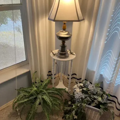 Small Plant Stand, Lamp, And A Couple Artificial Plants