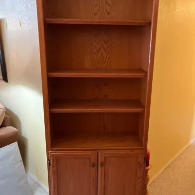 Tall Four Shelf Bookcase With Two Shelves Behind Doors