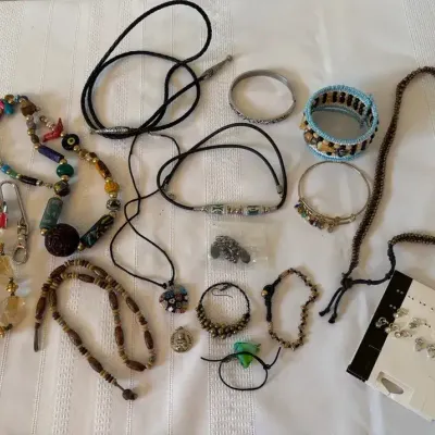 Necklaces, Bracelets, Earrings, And A Bolo Tie