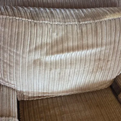 Sale Photo Thumbnail #9: Beige corduroy armchair featuring plush, ribbed upholstery on the backrest and seat cushion.