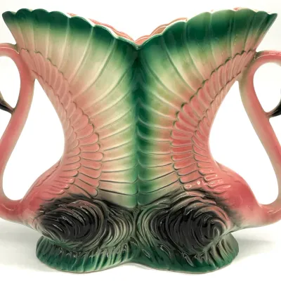 Sale Photo Thumbnail #48: Vintage mid-century Hull pottery double flamingo vase, featuring a pink and green glazed finish with detailed wing and feather textures.