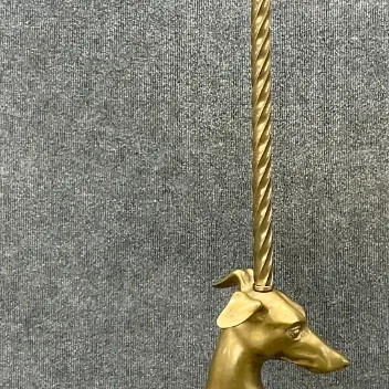 Sale Photo Thumbnail #20: Vintage brass floor lamp featuring a seated greyhound or whippet figure on a black octagonal base, with a twisted metal pole and harp.