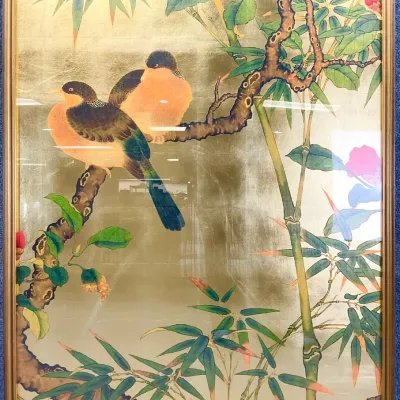 Sale Photo Thumbnail #98: Framed Asian-style art print featuring two birds perched on a branch amidst bamboo and red blossoms, set against a metallic gold leaf background.