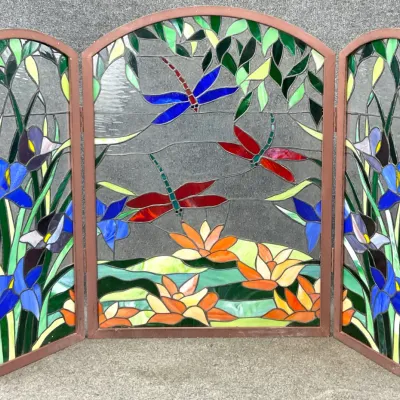 Sale Photo Thumbnail #21: Three-panel stained glass fireplace screen featuring a vibrant nature scene with dragonflies, water lilies, and irises in a wooden frame.