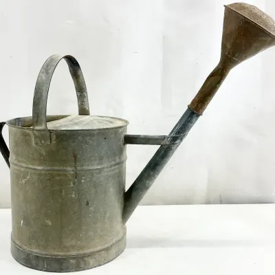 Sale Photo Thumbnail #87: Vintage galvanized metal watering can featuring a long spout with a copper-toned rose sprinkler head and a sturdy overhead handle.
