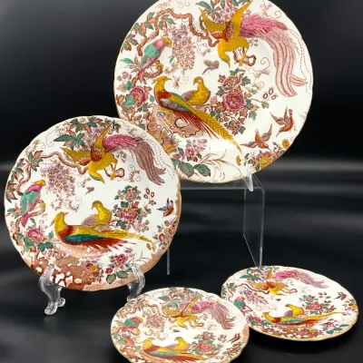 Sale Photo Thumbnail #32: Four Spode "Peplow" pattern plates of varying sizes, featuring a colorful transferware design of exotic birds and floral branches with gilded rims.