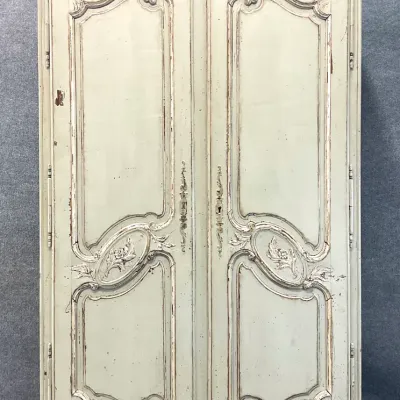 Sale Photo Thumbnail #85: French Provincial style painted armoire featuring a distressed sage green finish, ornate carved floral details, and elegant cabriole legs.