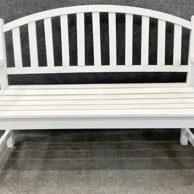 Sale Photo Thumbnail #35: White painted wooden garden bench featuring an arched slat back and slatted seat.