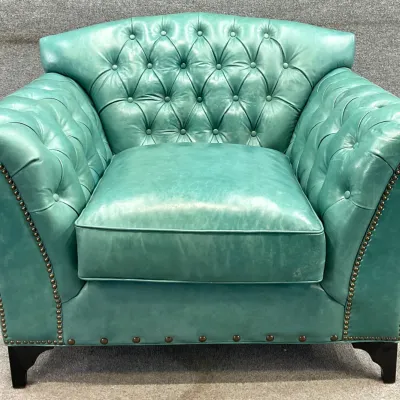 Sale Photo Thumbnail #49: TOV Furniture teal leather Chesterfield-style armchair featuring deep button tufting, rolled arms, and brass nailhead trim.