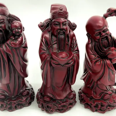 Sale Photo Thumbnail #46: Set of three Chinese Fu Lu Shou cinnabar-style resin figurines, representing the gods of prosperity, status, and longevity.