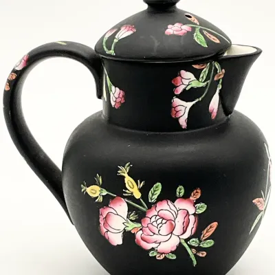 Sale Photo Thumbnail #25: Vintage matte black ceramic pitcher with lid, featuring hand-painted pink floral motifs in a Chinoiserie style.