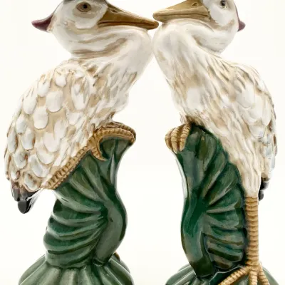 Sale Photo Thumbnail #22: Pair of vintage majolica-style ceramic heron candlesticks, featuring herons perched on green leaves with lotus flower candle holders atop their heads.