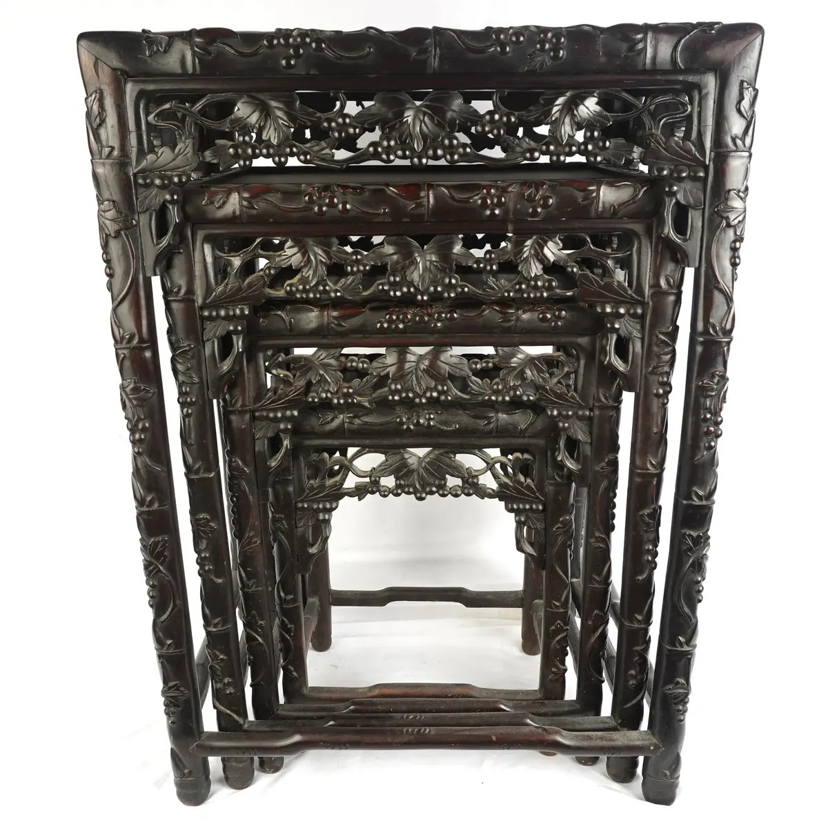 Set Of 4 Carved Dark Wood Nesting Tables With Pierced Grape Vine Aprons