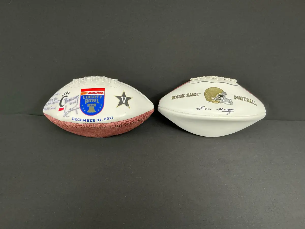 Lou Holtz Autographed Notre Dame Football And Liberty Bowl Ball