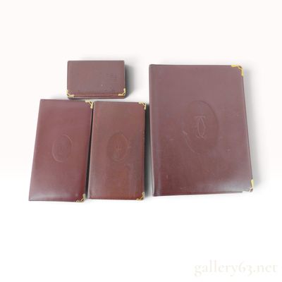 A Collection of Vintage Must de Cartier Burgundy Leather Accessories