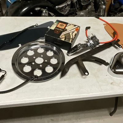 A Collection of Harley-Davidson and Aftermarket Motorcycle Components and Accessories