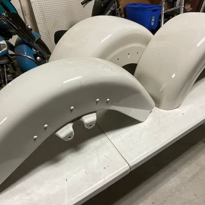 Three White Gloss Motorcycle Fenders Comprising One Metal Front Fender and Two Fiberglass Rear Fenders