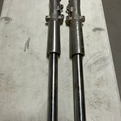 A Pair of Showa Motorcycle Front Fork Assemblies Part Numbers R46502-06 and L46495-06