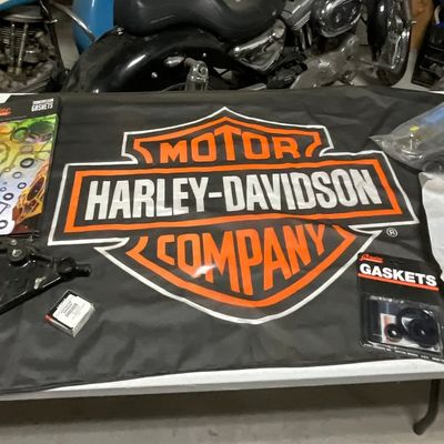 A Group of Harley-Davidson and Aftermarket Motorcycle Parts and Accessories including Gasket Sets and Fork Gaiters