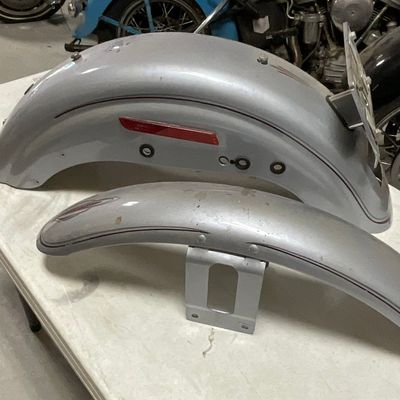 A Pair of Silver Metallic Pinstriped Motorcycle Fenders