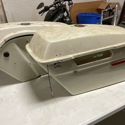 A Pair of Fiberglass Top Loading Motorcycle Saddlebags