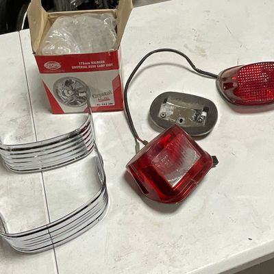 Collection of Motorcycle Lighting and Chrome Trim Including Autopal and Harley-Davidson Parts