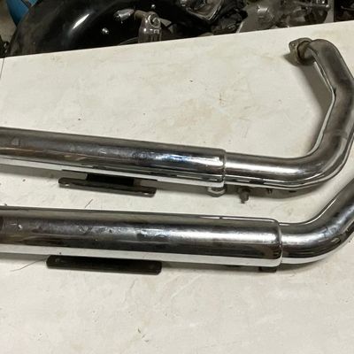 A Set of Vance and Hines Chrome Staggered Dual Exhaust Pipes for Harley-Davidson